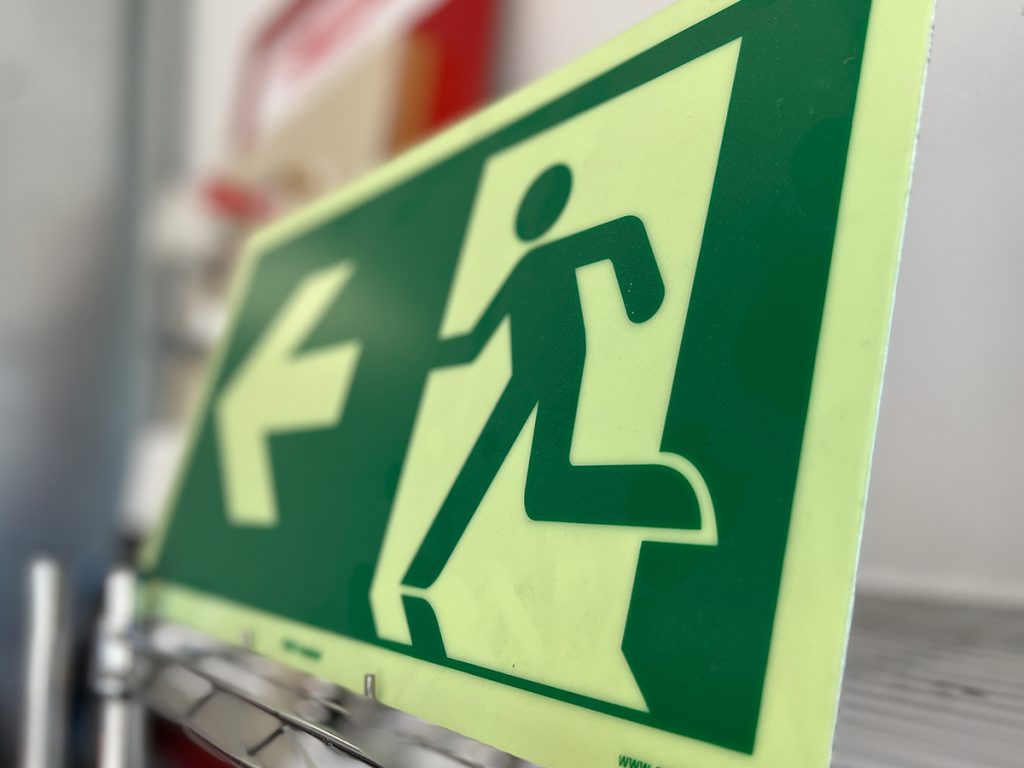 A close up of an evacuation blazon sign